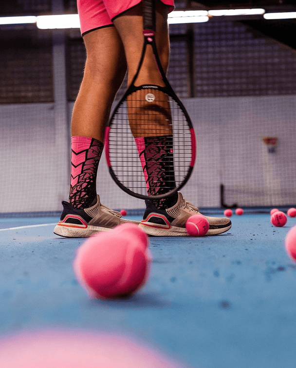 Model sitting in outdoors Tenis court.