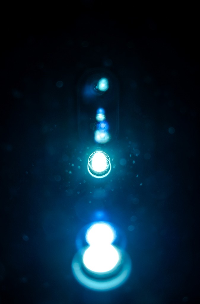 a close up of a traffic light in the dark