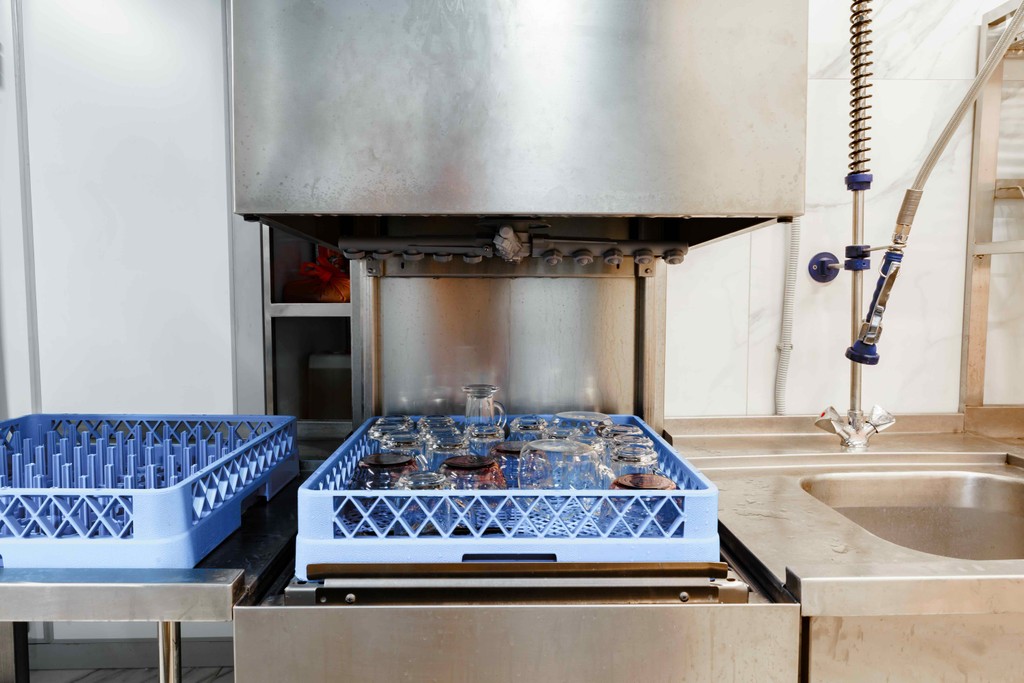 turned-on gray converyor machine