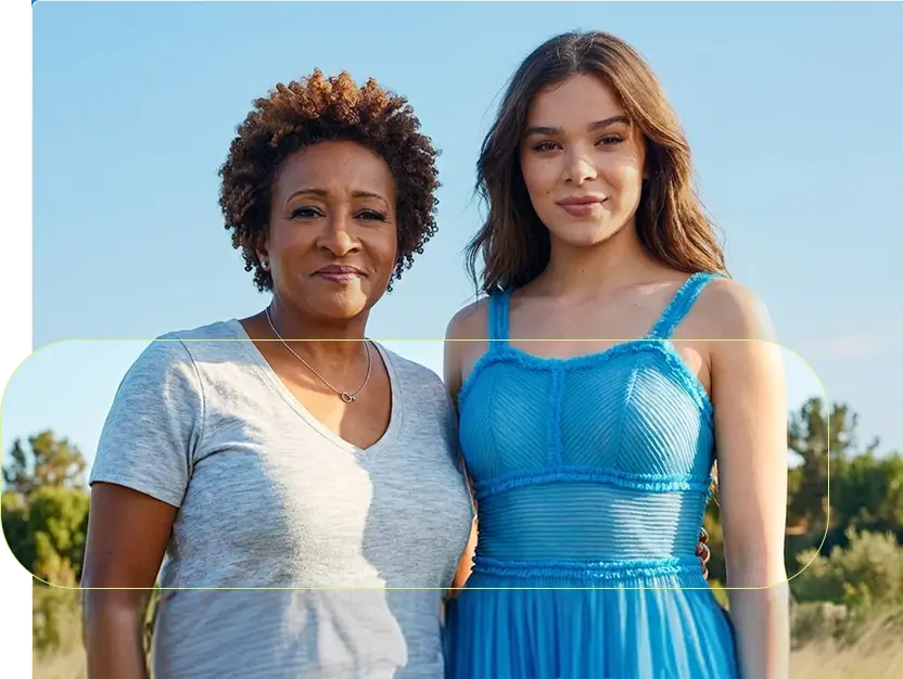 Your Attention Please advocates Wanda Sykes and Hailee Steinfeld standing confidently together.