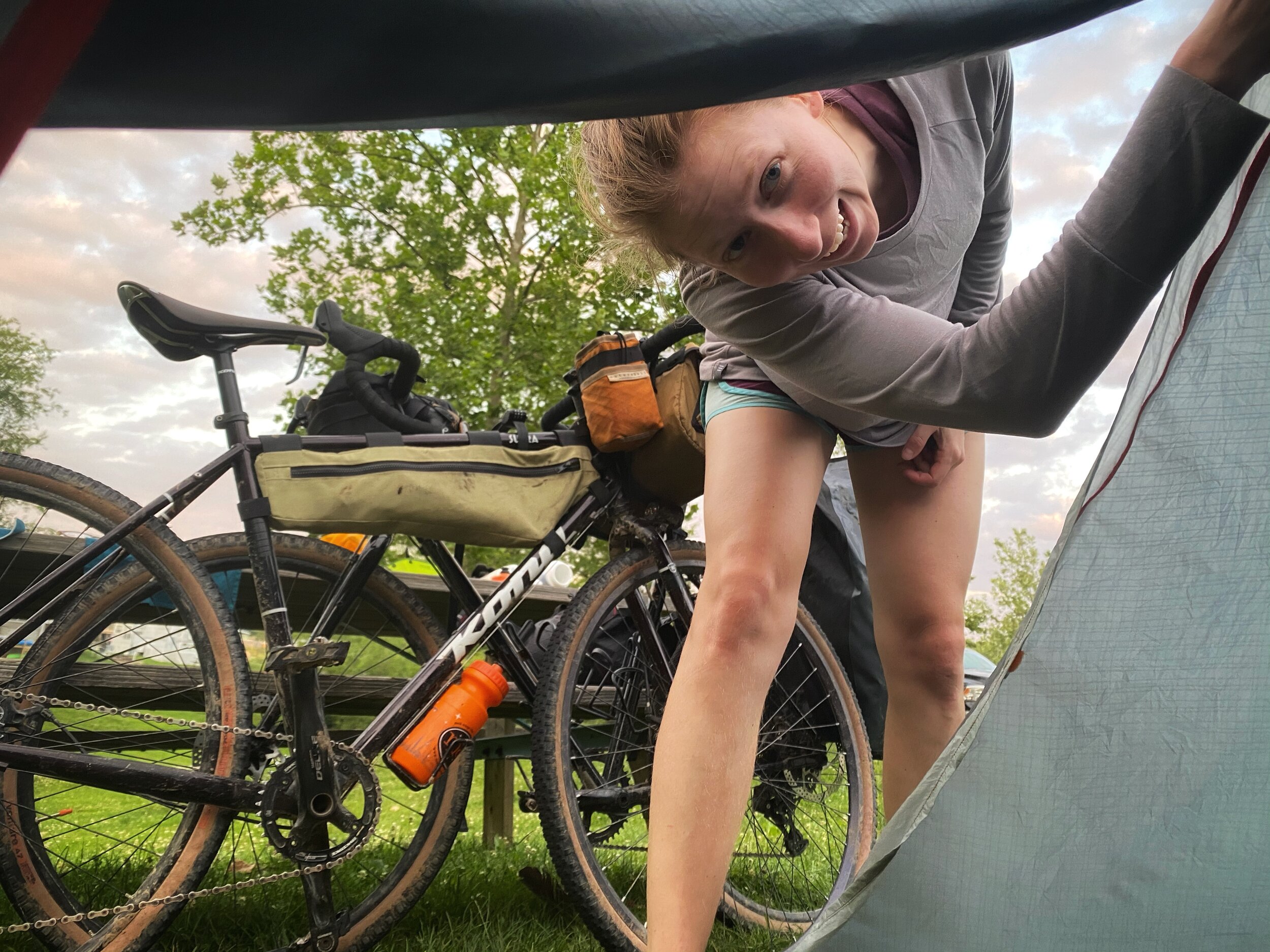 a row of Citibikes lined up in their docks on the side of a New York street