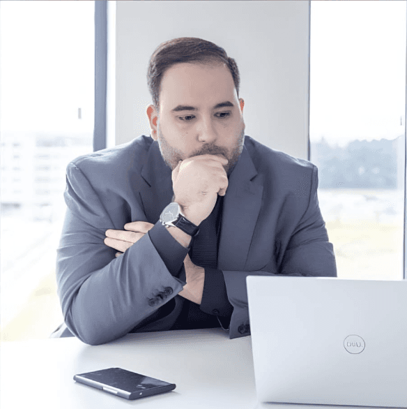 man standing near high-rise building