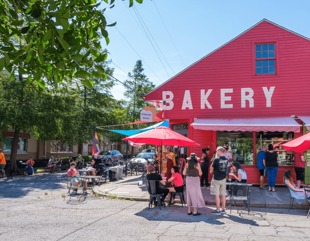 Crowd of people enjoying outdoor dining at the Bywater Bakery in the Bywater in New Orleans