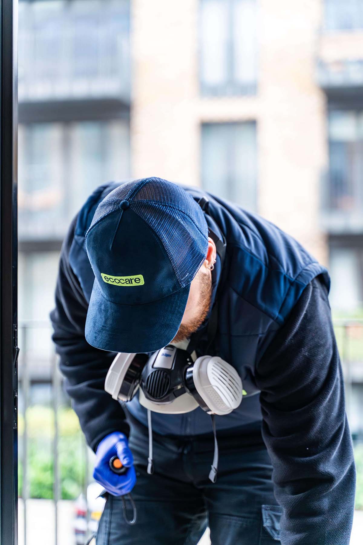 Ecocare branded cap worn by pest control technician - Professional pest management services