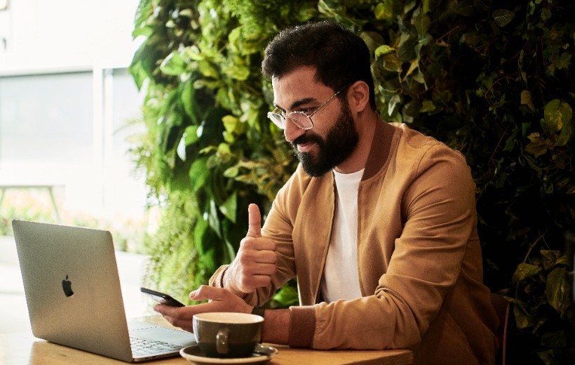 Man with laptop and coffee