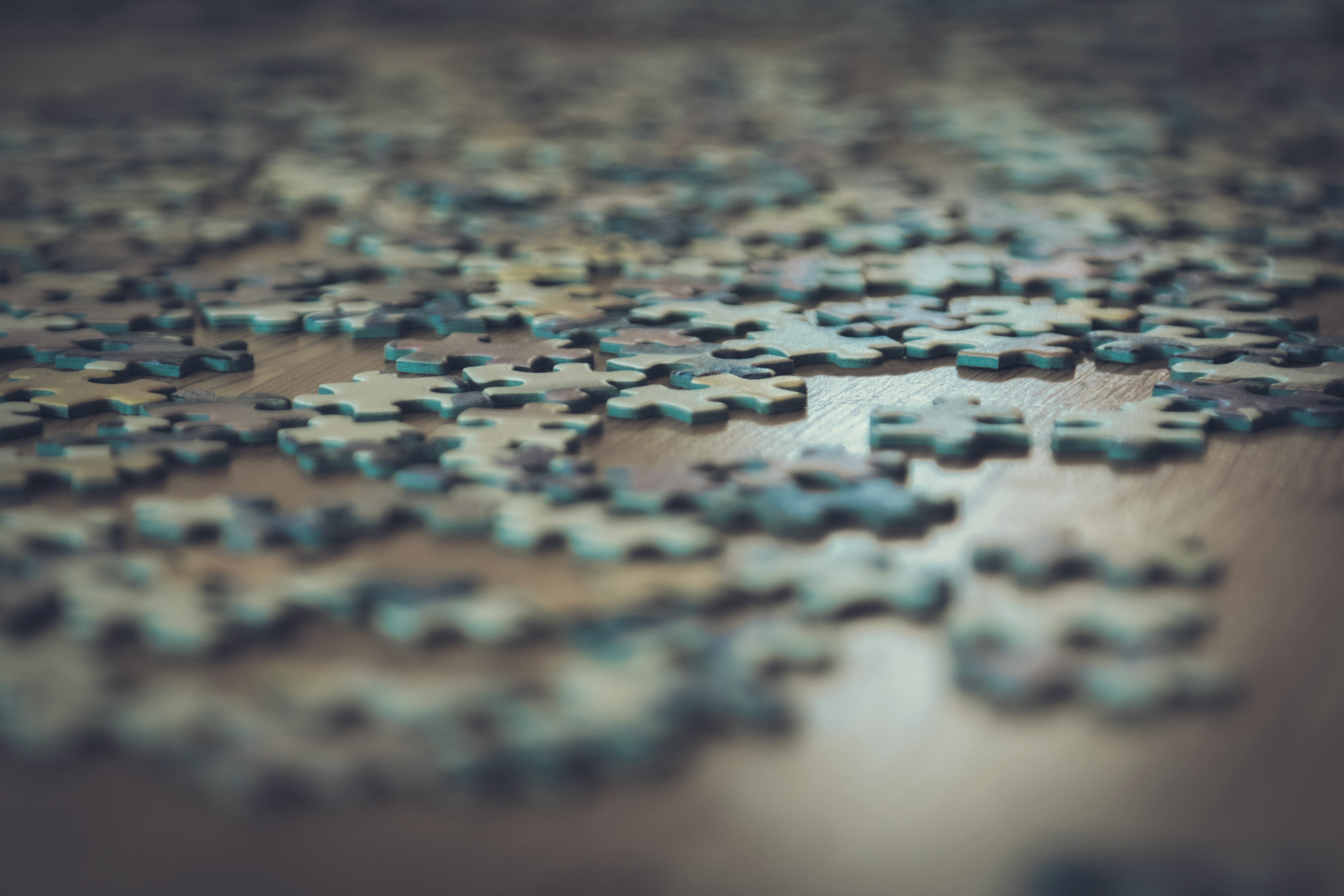 a close up of a puzzle piece on a table