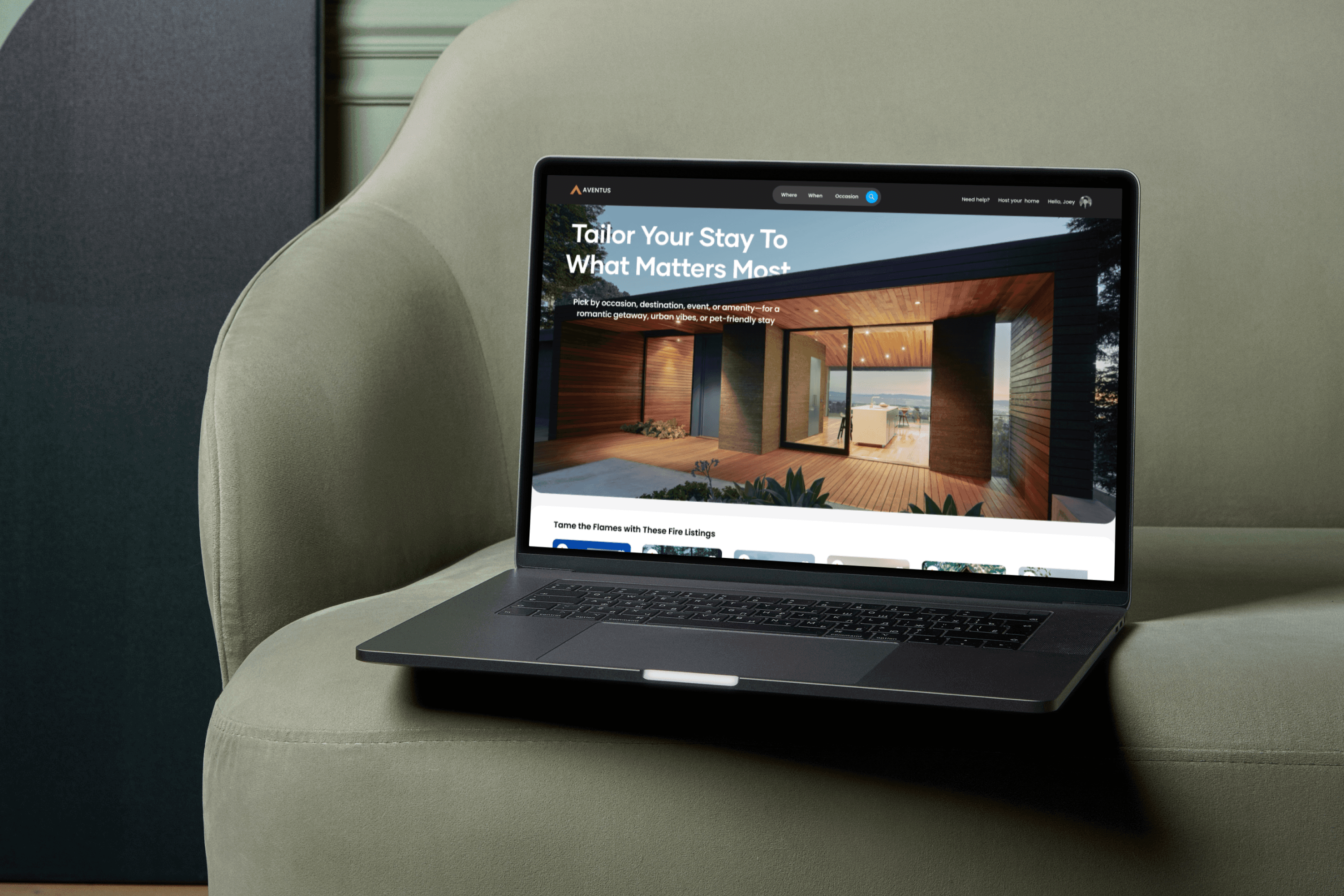 Laptop on a green armchair, displaying the Aventus hero section.