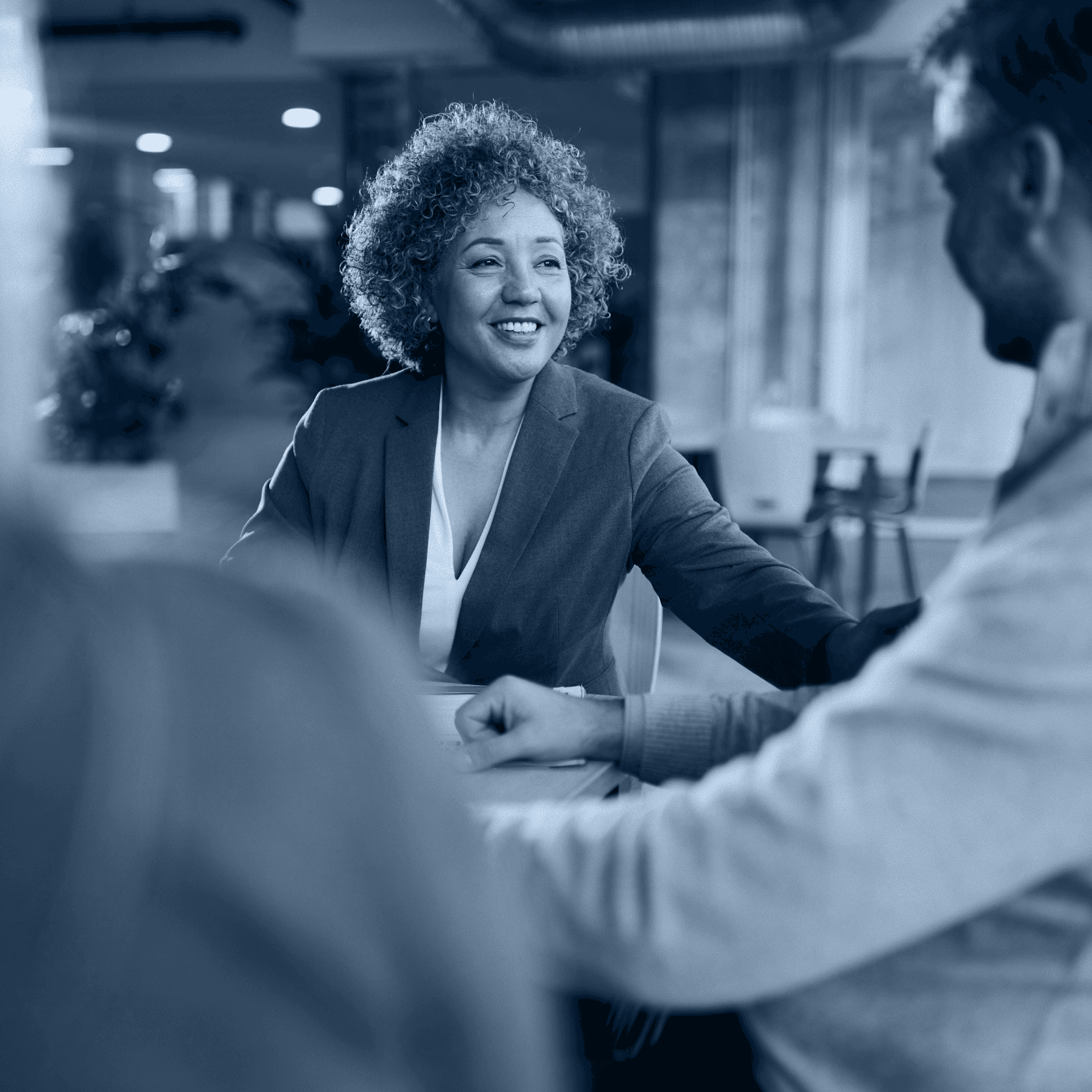 two people looking at a tablet and smiling