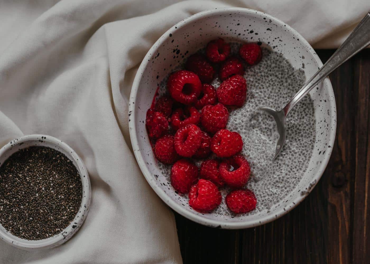 Chia seed pudding in a bowl topped with raspberries