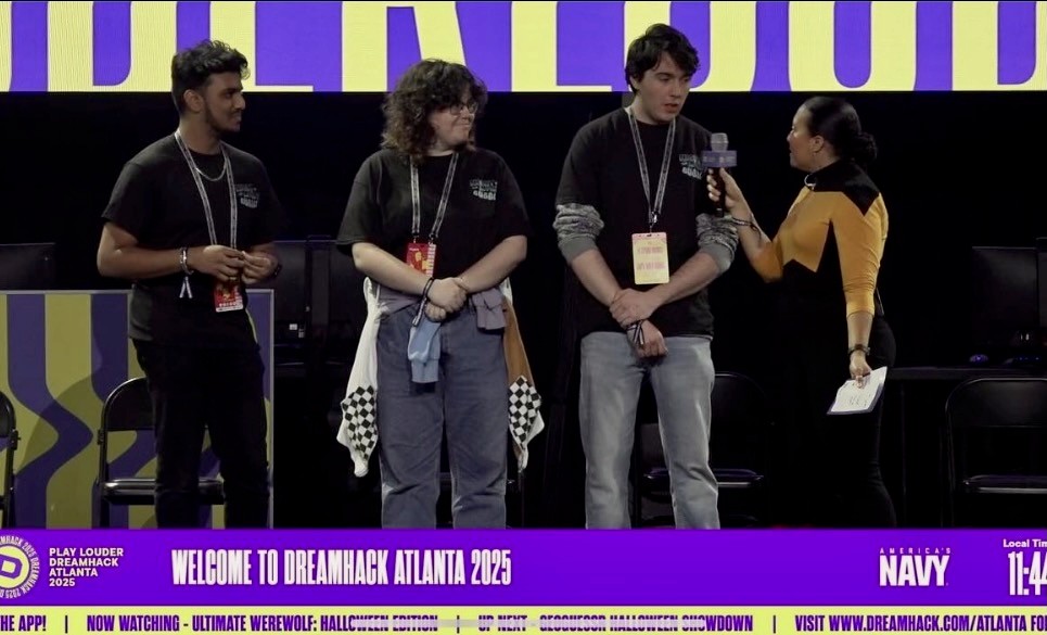people in a large building with Tate Modern in the background