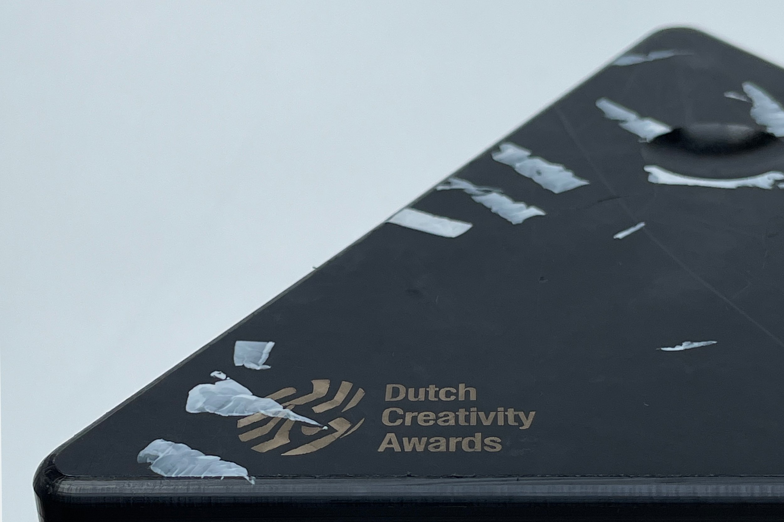 Image of a recycled plastic HIPS award base with laser-engraved text