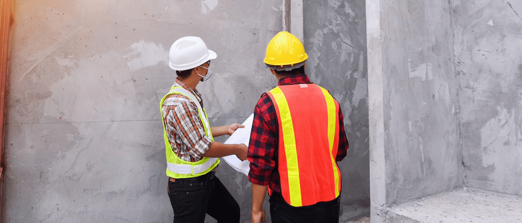Inspector reviewing Concrete Wall