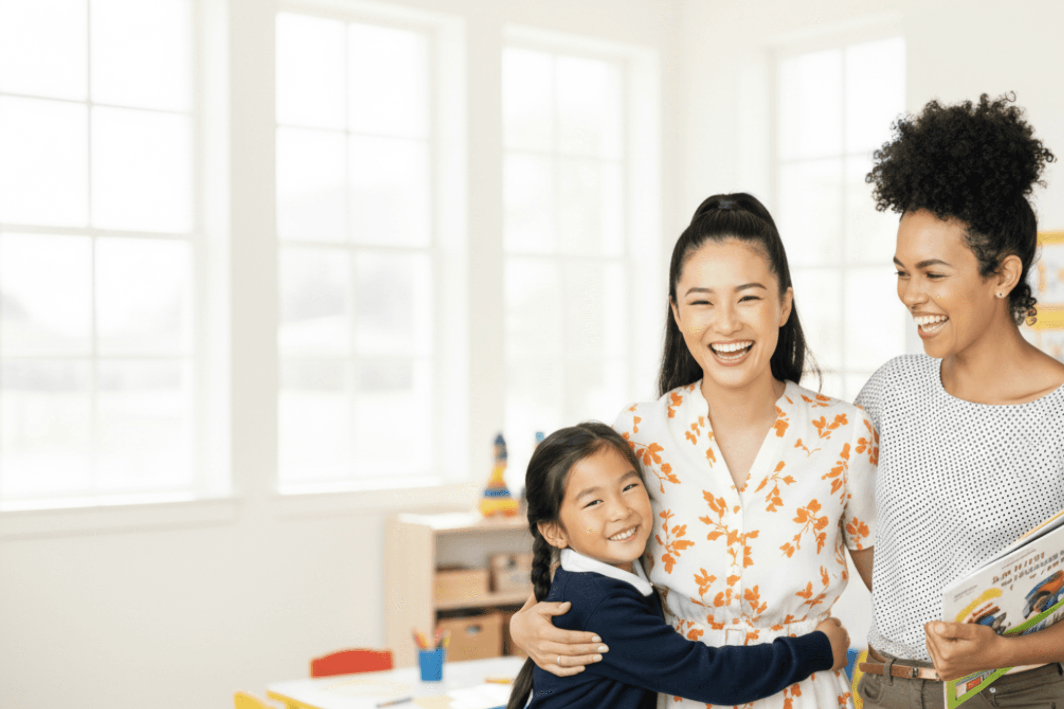 Kina homepage hero image with a happy family running on the beach, illustrating tuition rewards and payment flexibility