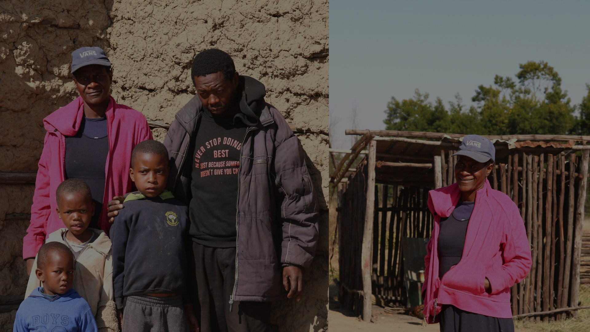Smiling children hold plates of hot food while waiting in line at a meal distribution site.