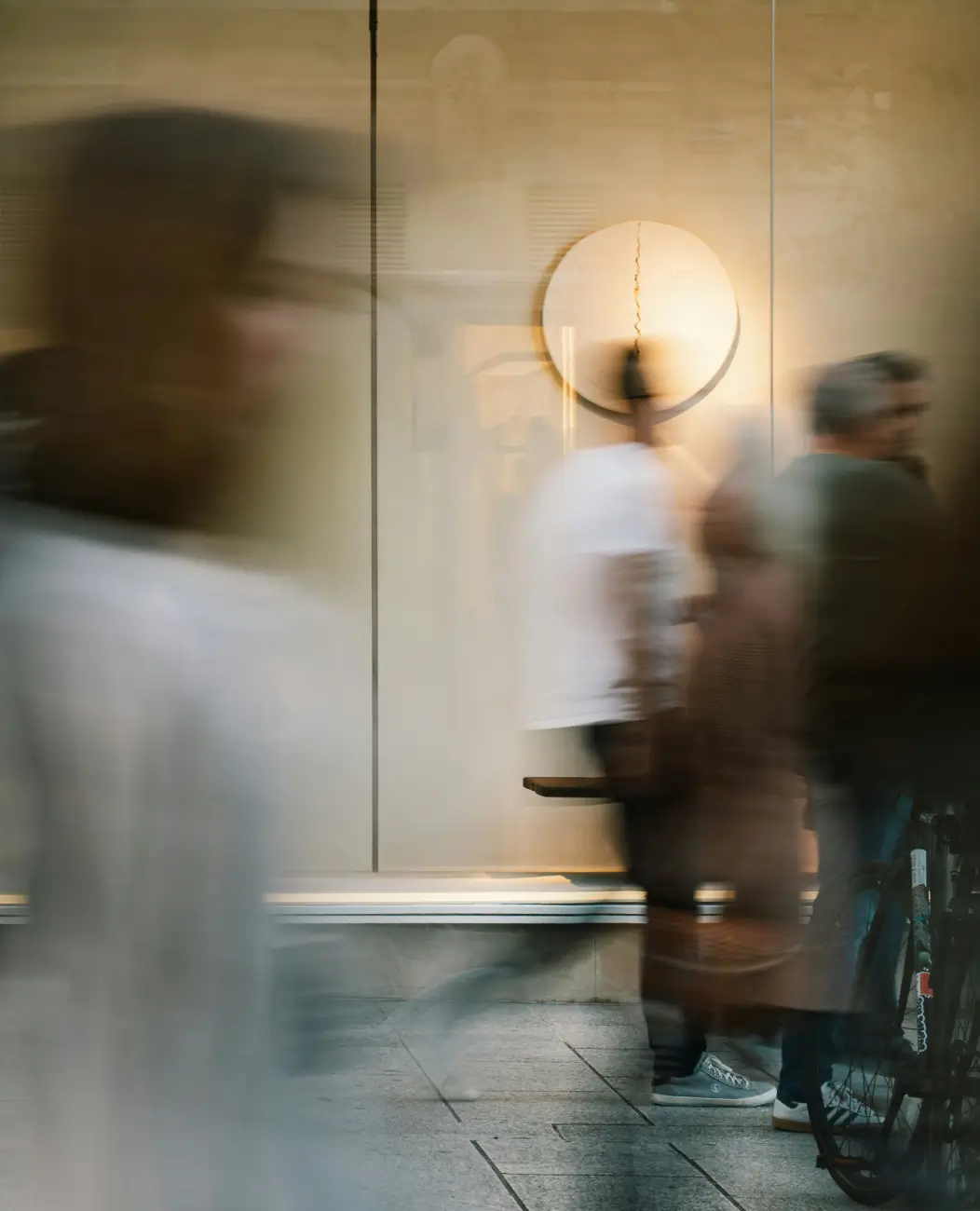 A blurry effect image of people walking through a room