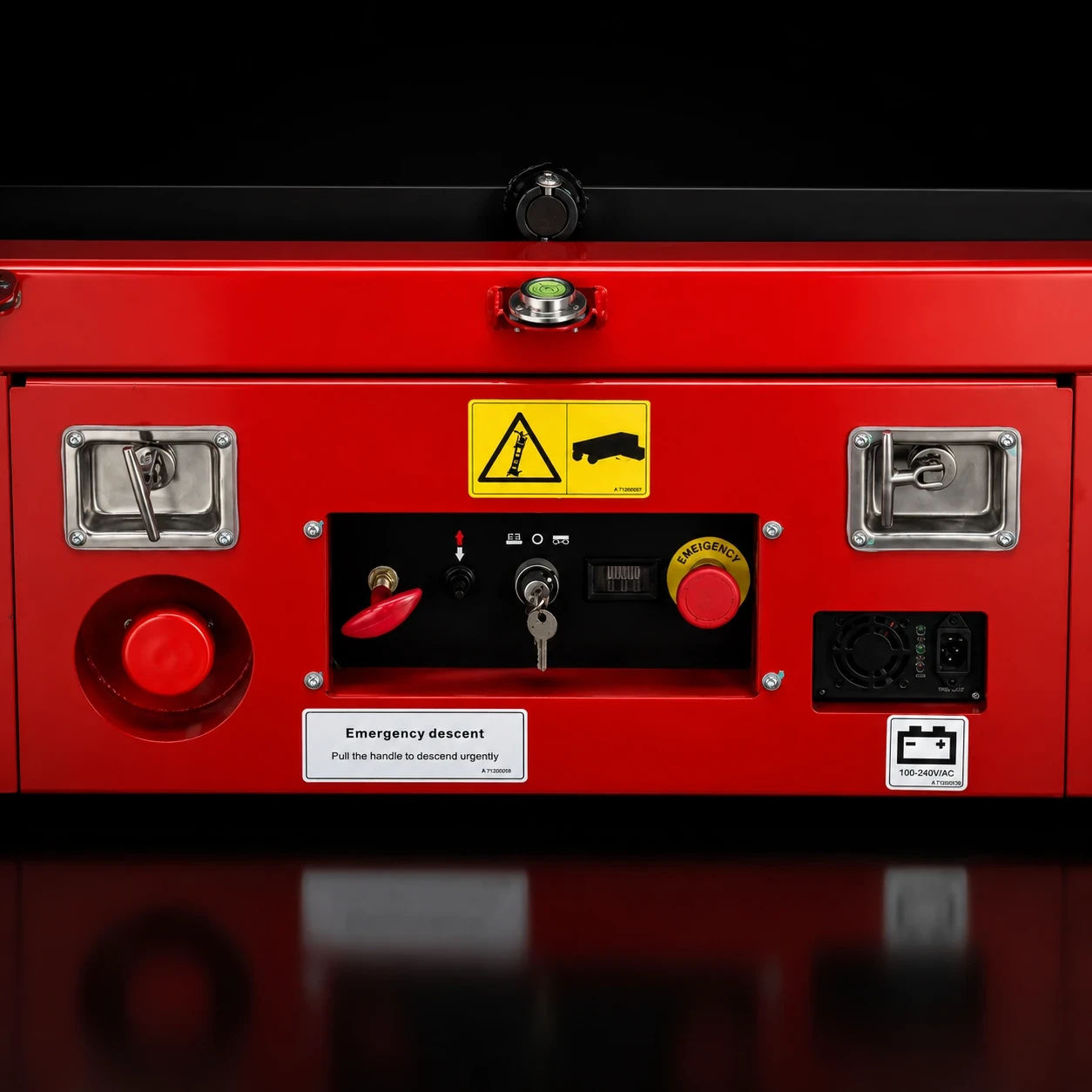 Lower control panel of scissor lift with emergency stop, key switch and operating controls.