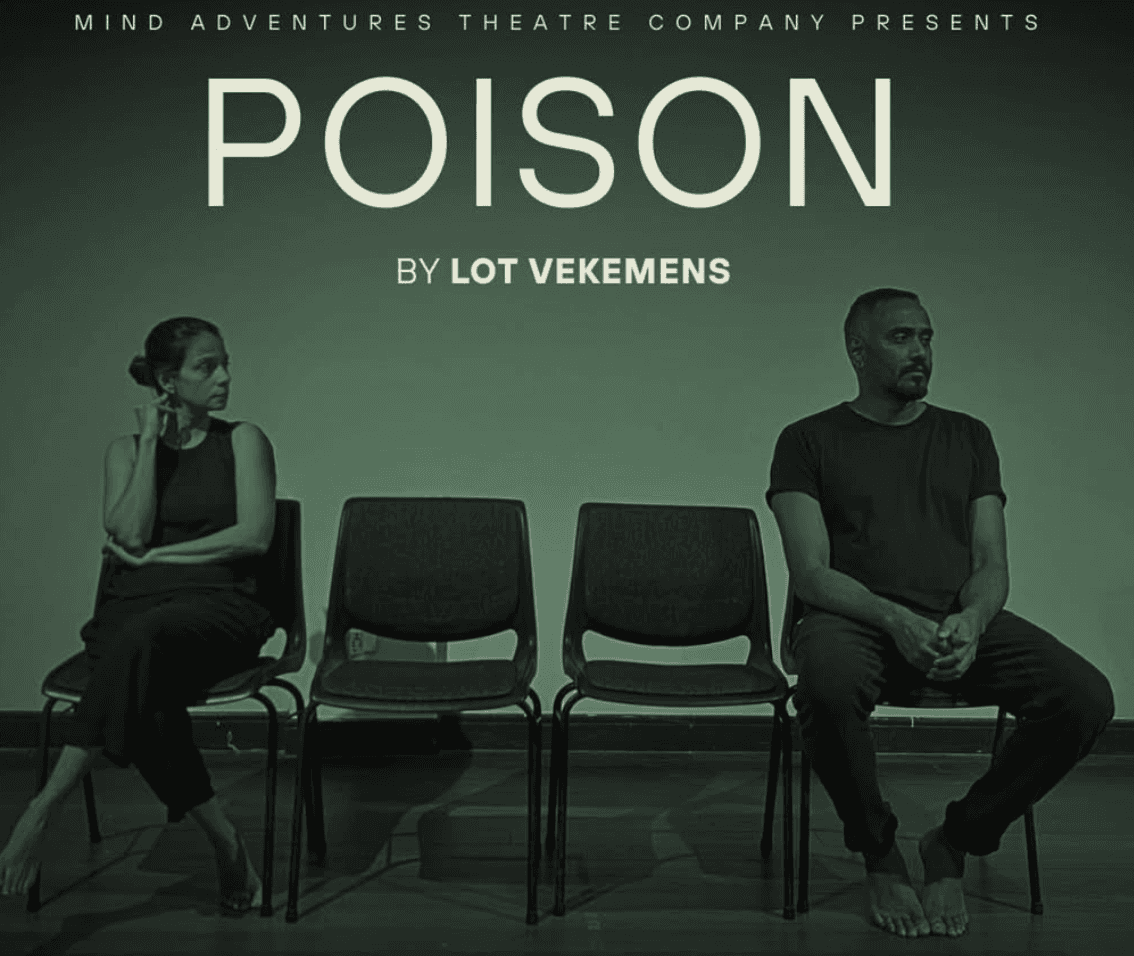 A man playing a drum in front of a group of people