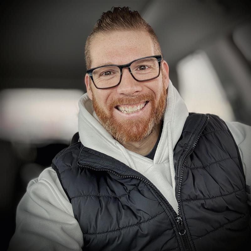 Headshot of Tim Blake, smiling with a full beard. He is the Director of Mission Impact.