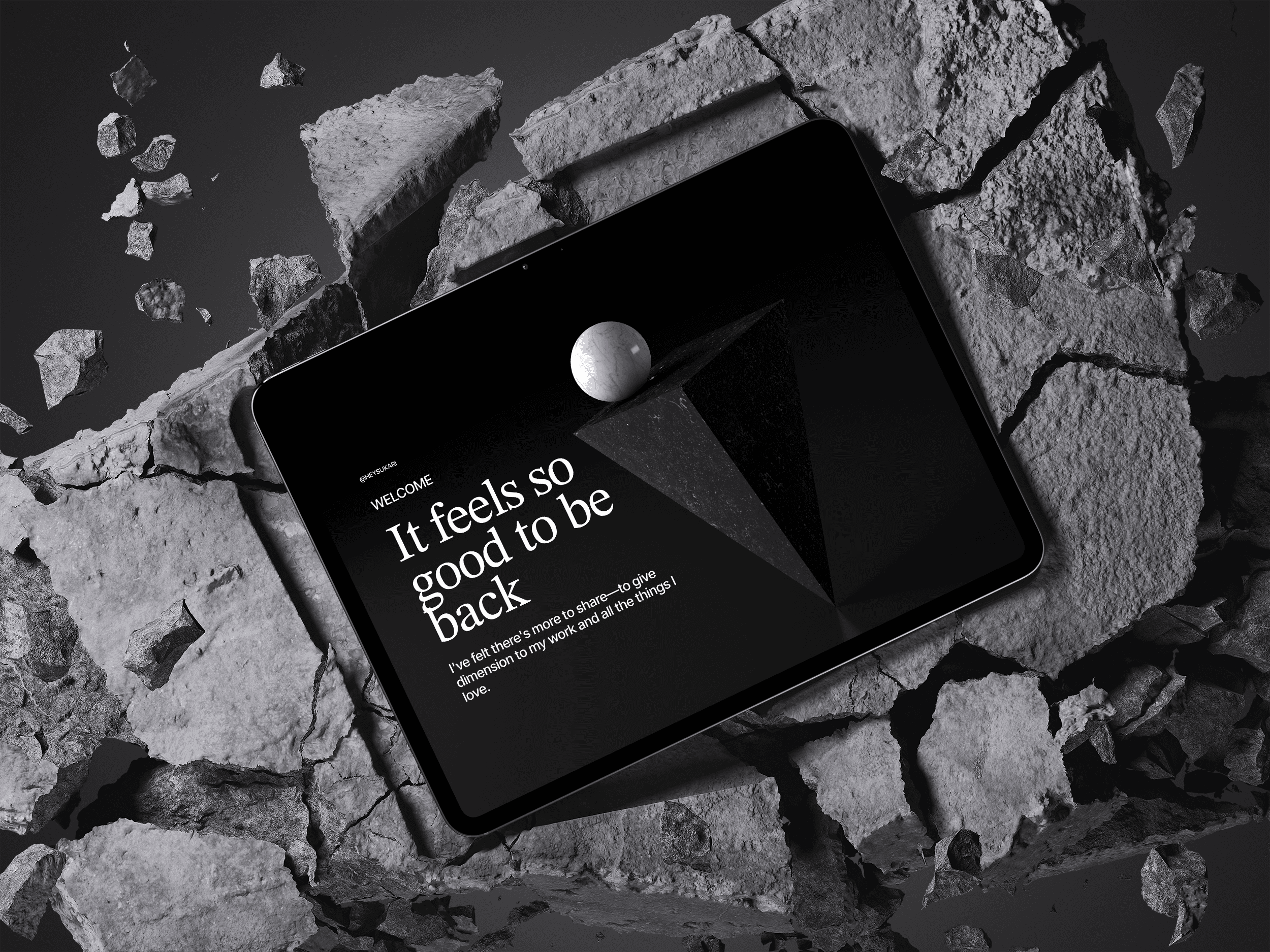 A tablet resting on broken concrete displays a dark editorial screen. Serif headline reads: "It feels so good to be back." Welcome issue by @heysukari.