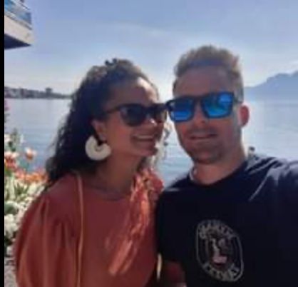 woman in black long sleeve shirt sitting on white couch