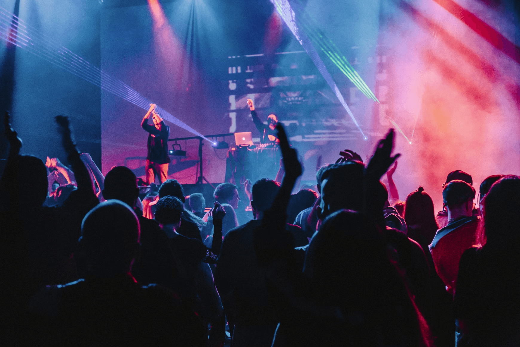 Woman singing on stage. Photo by Aleksandr Popov on Unsplash