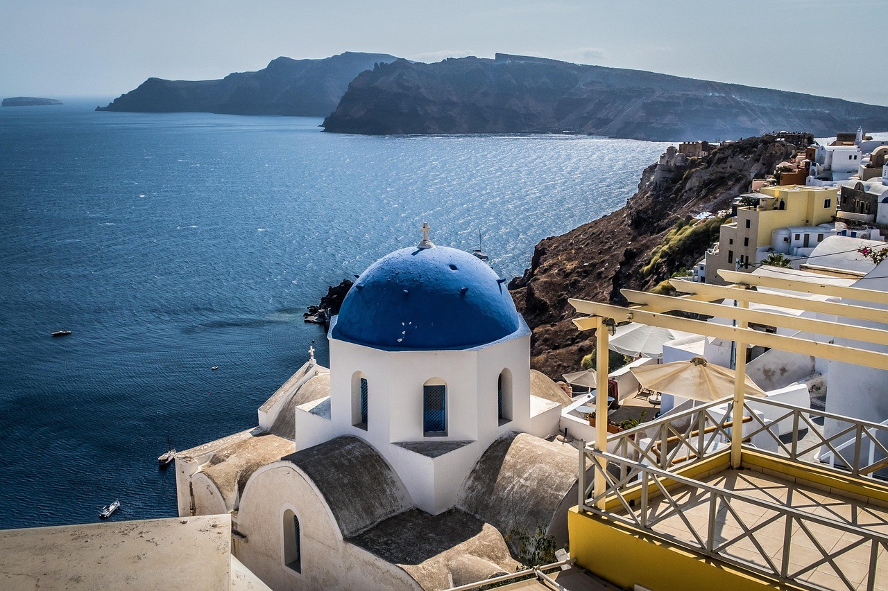 a group of people standing around a fountain