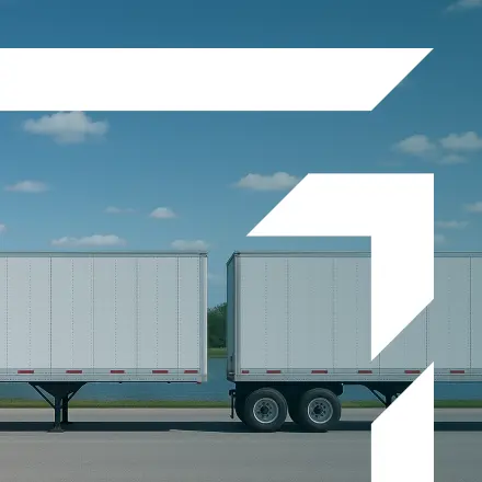 Two white semi-trailers parked on a lot under a blue sky — representing GIA Group, LLC’s Trailer Interchange Insurance.