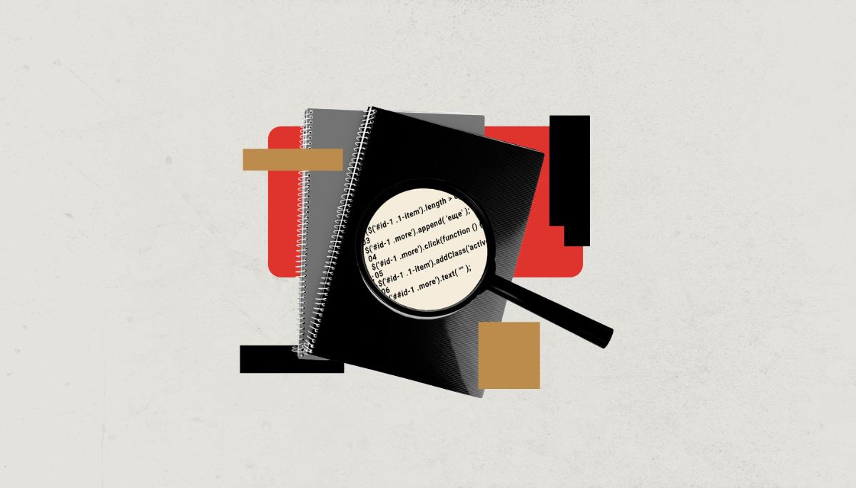 Magnifying glass highlighting code on a notebook.