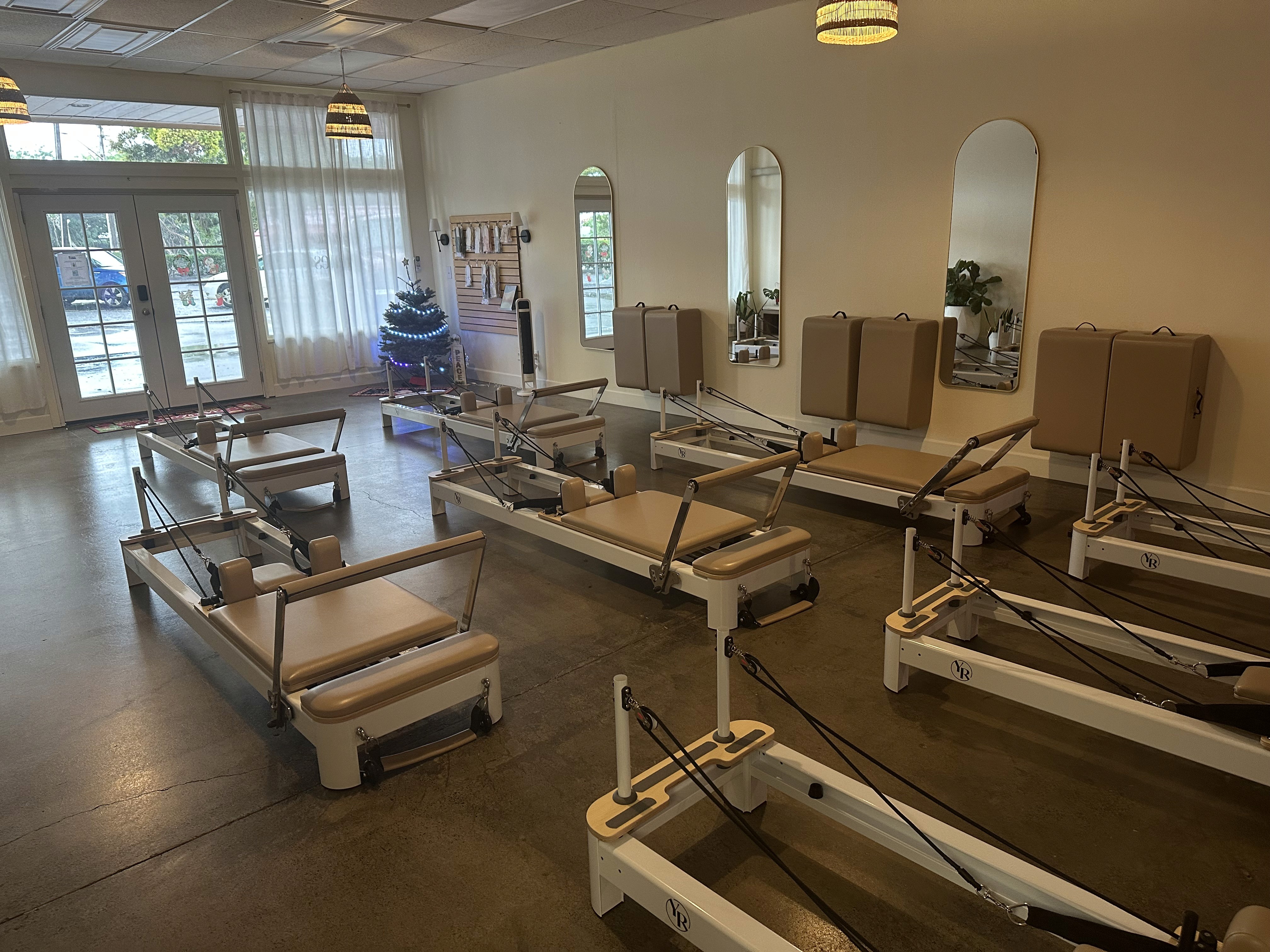 a woman is doing a piyoma exercise in a gym