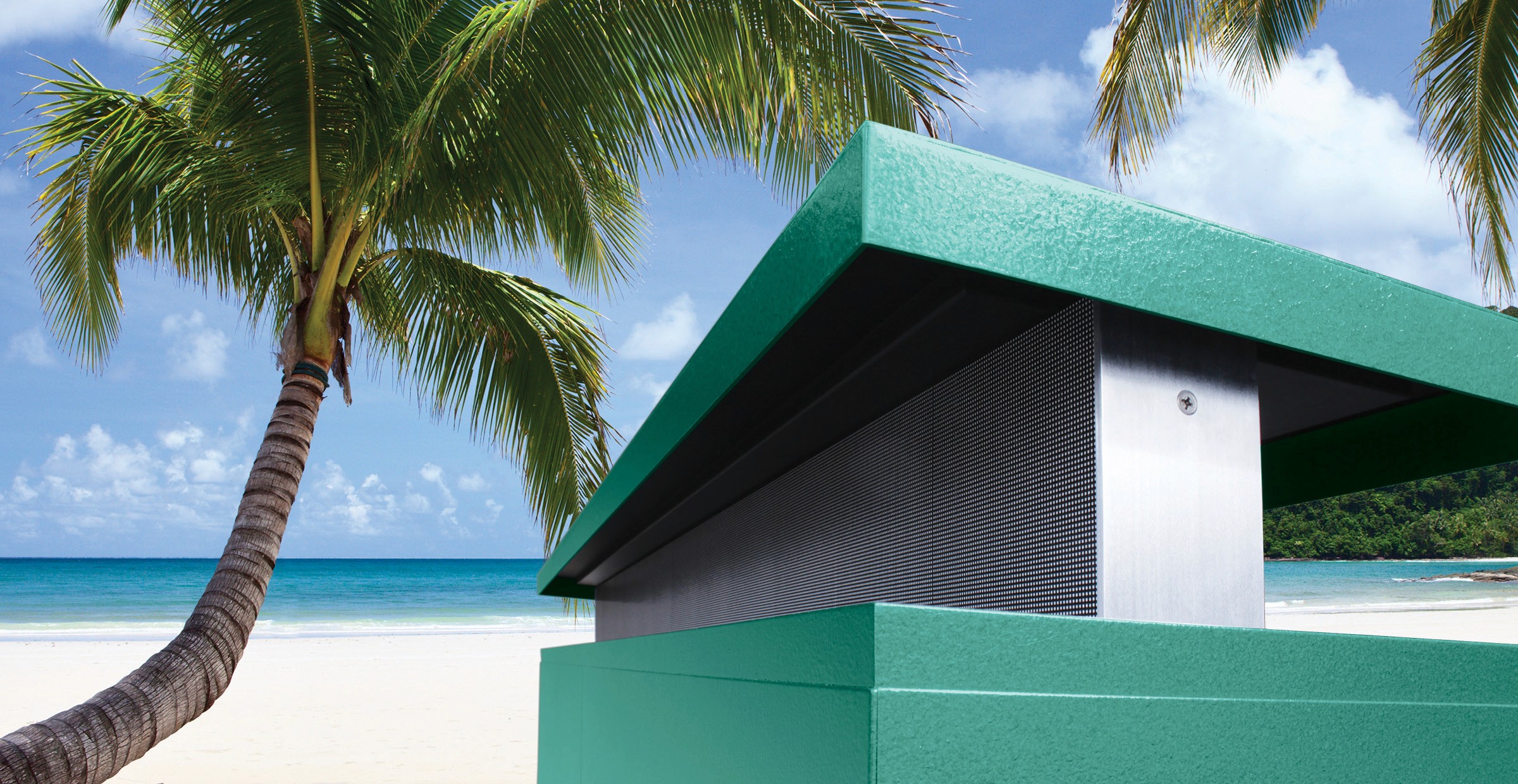 Green structure on a beach next to a palm tree.