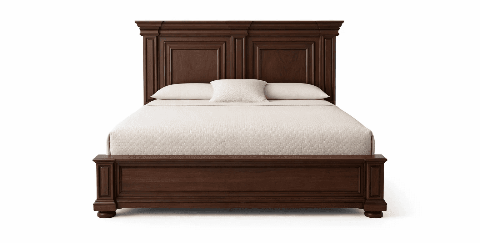 Classic wooden bed with stepped headboard design and broad side rails
