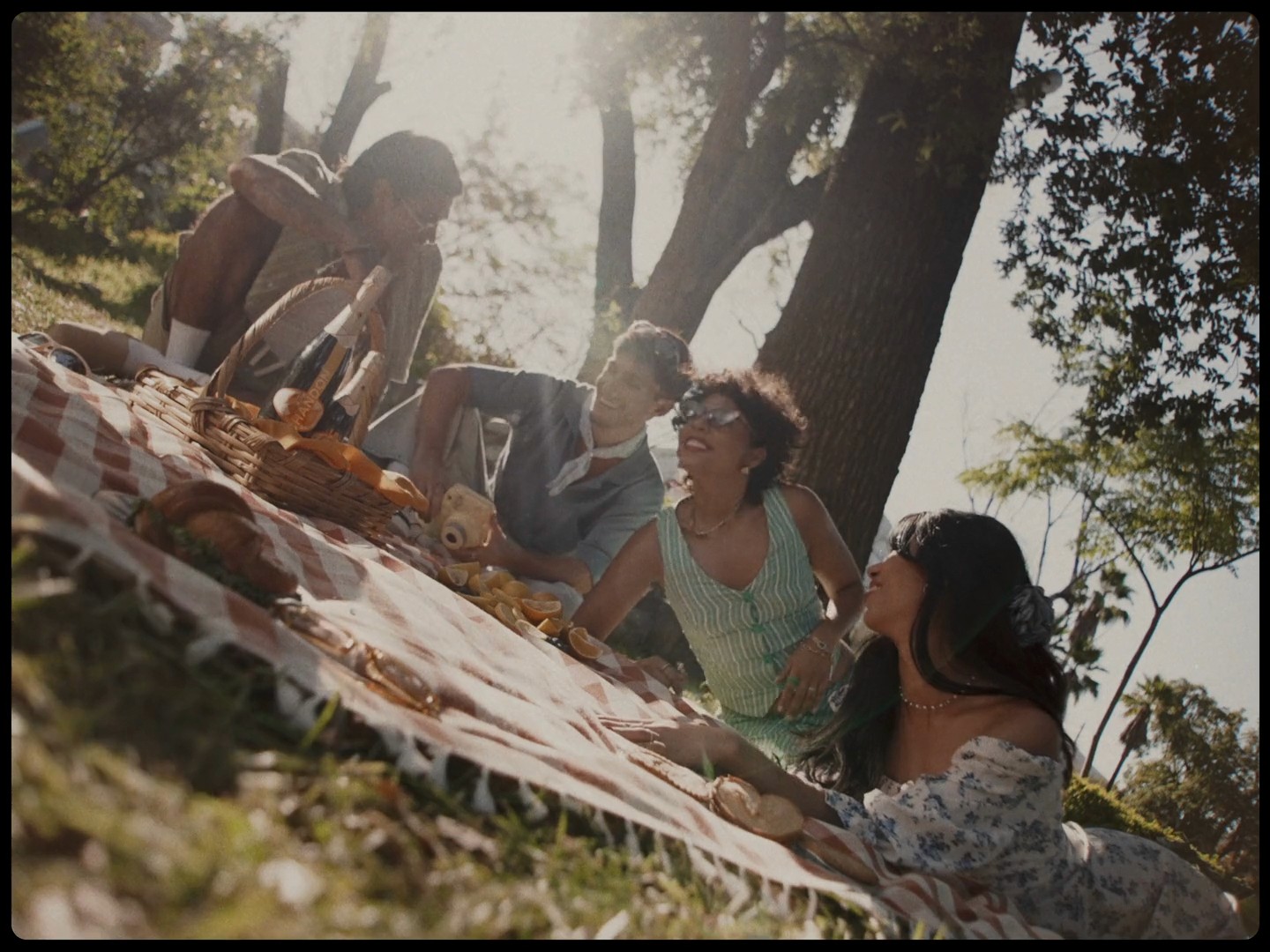 cinematic still from the Vinoteca "Summerliers" commercial, where the light reveals the essence of a shared summer experience produced by antimateria films and dir by mike bautista 