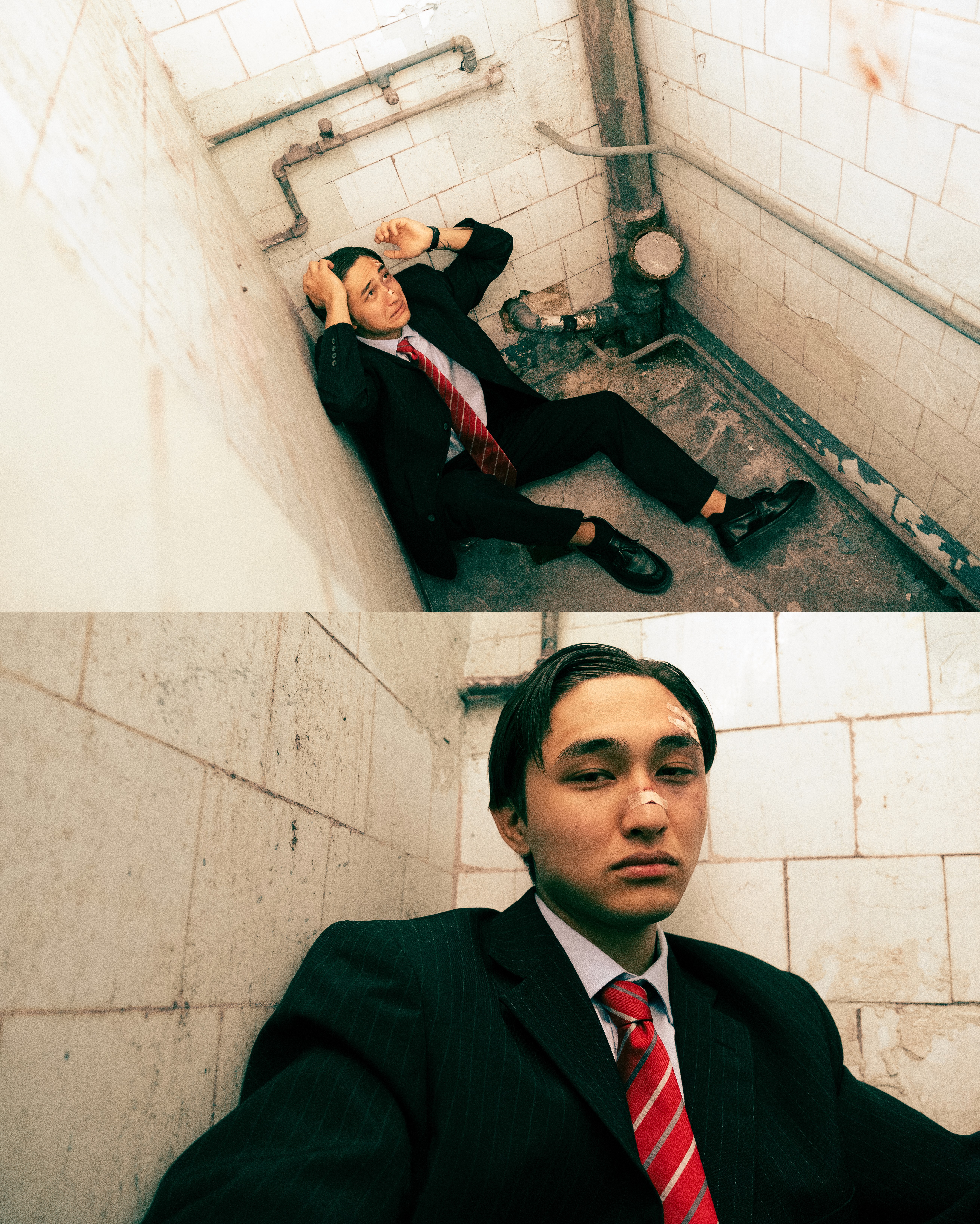 Argen – Loud Silence – close-up seated in a confined tiled space with a calm, exhausted expression