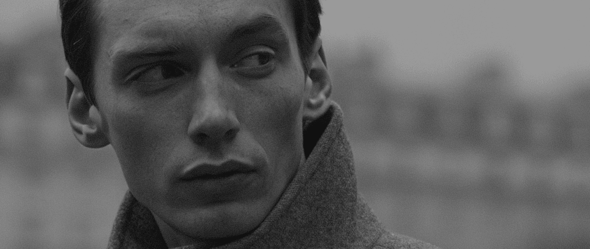 Max longchamp looking to side side, black and white picture