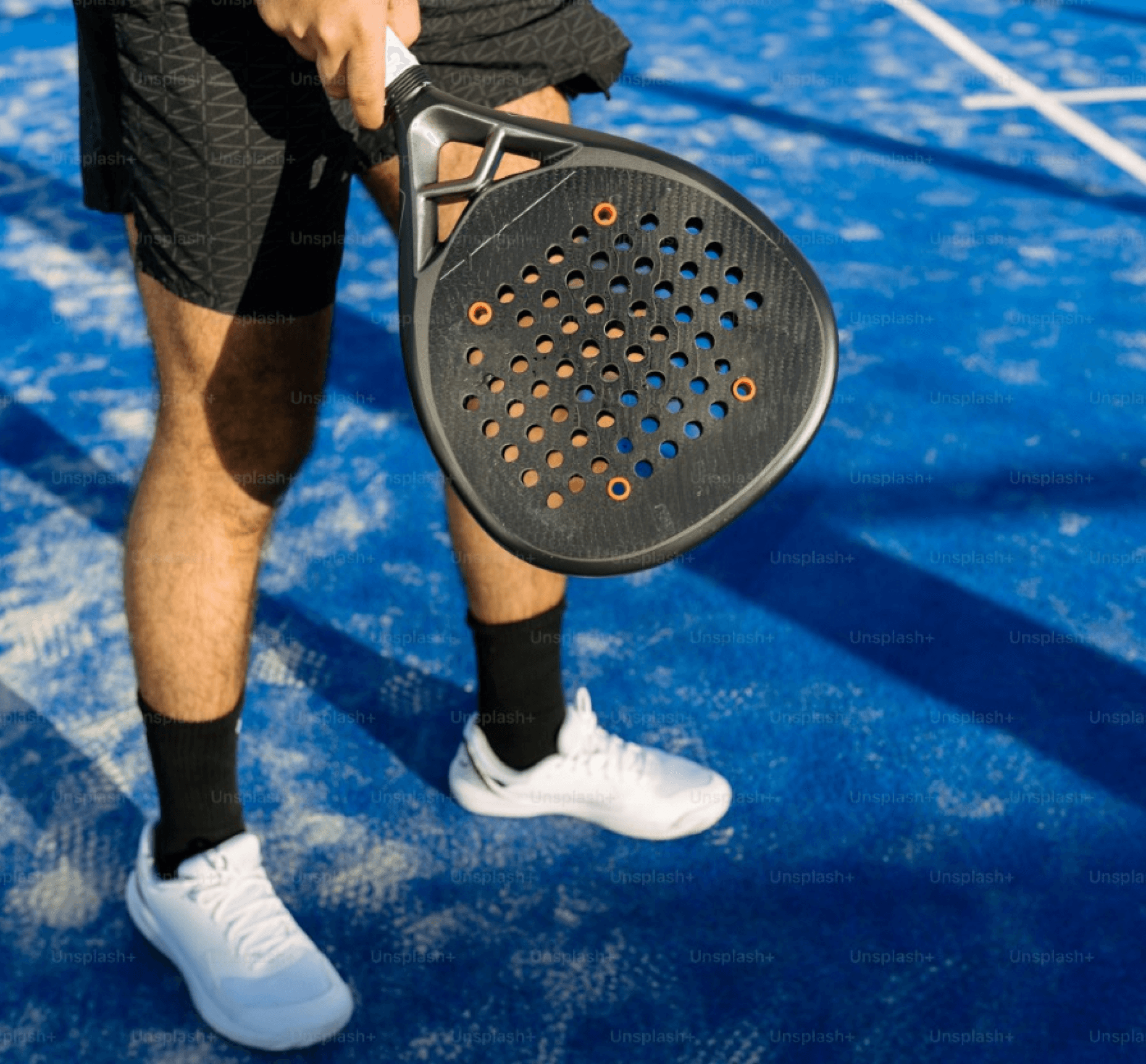 Man holding a short-handled paddle