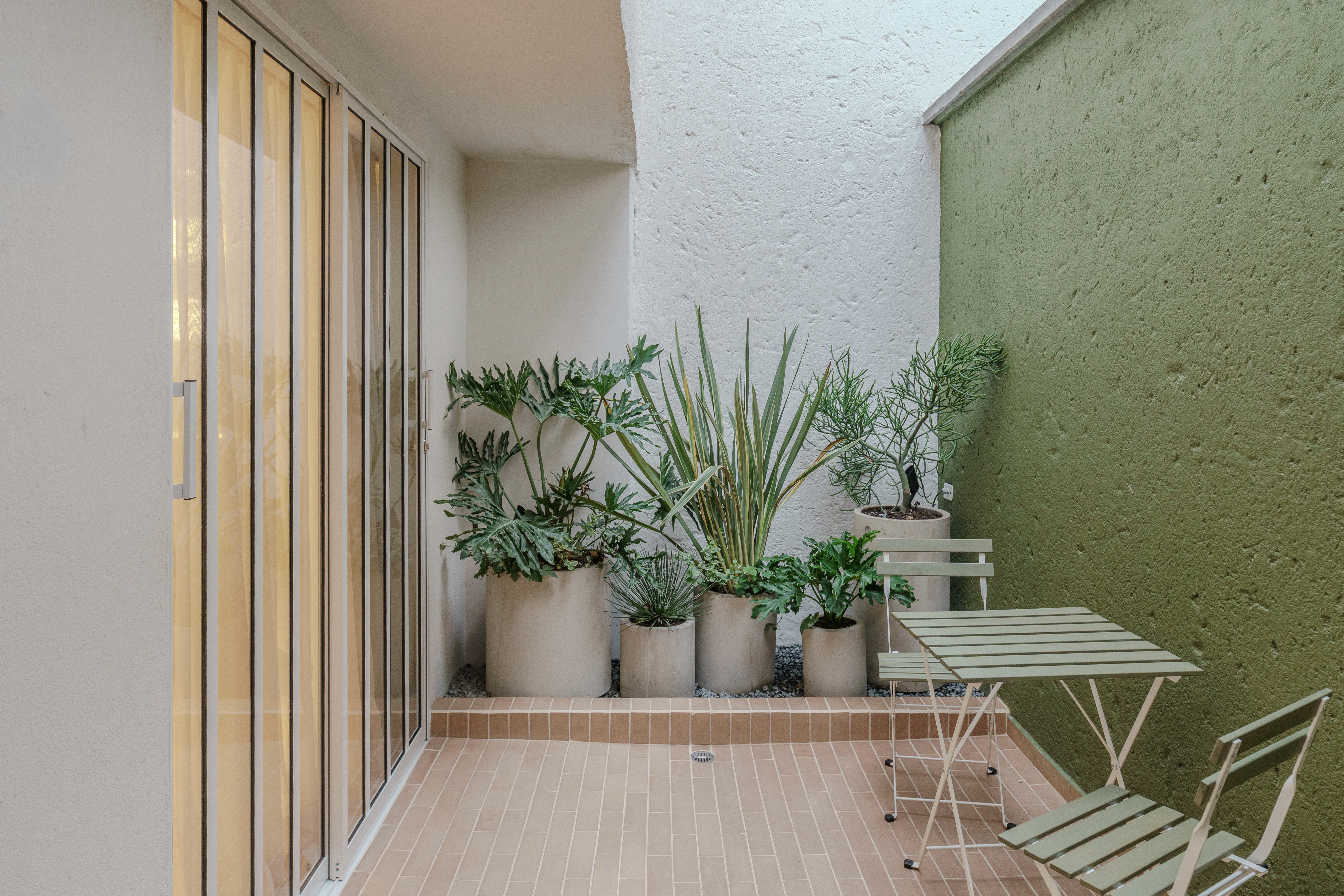 Double-height interior with flowing sculptural forms and warm raking light