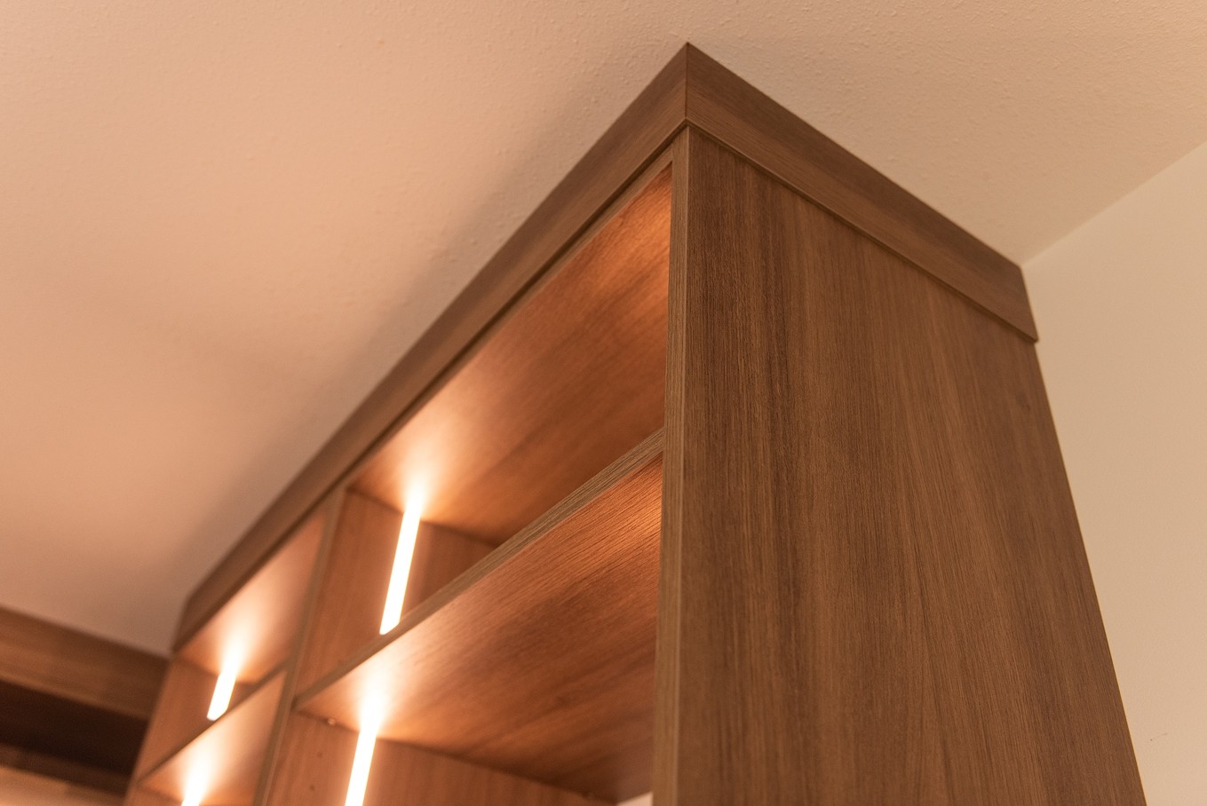 Tall wardrobe unit with detailed crown