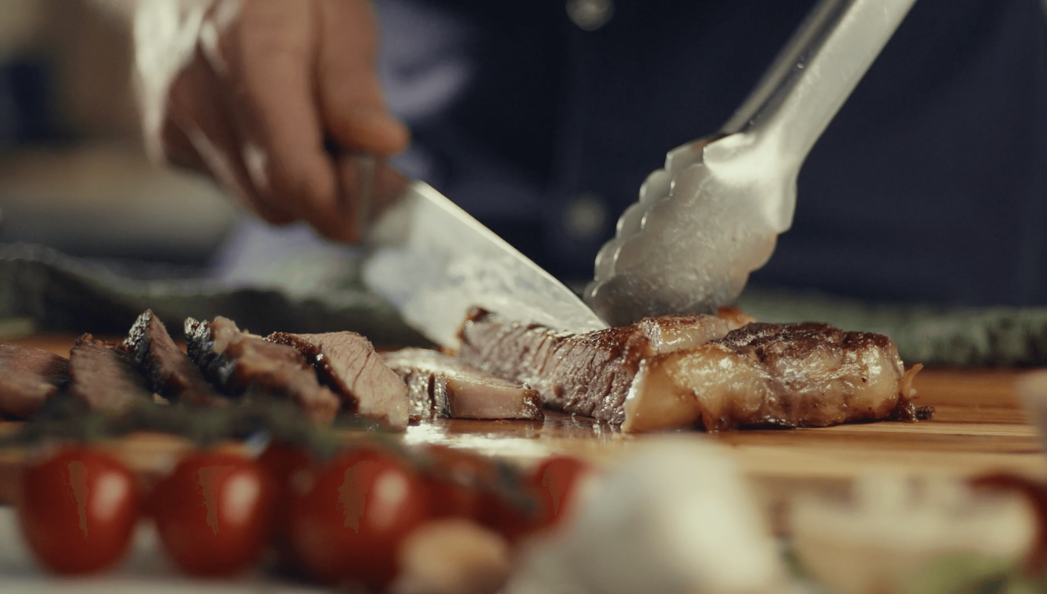 View from helicopter cockpit over coastal mountains