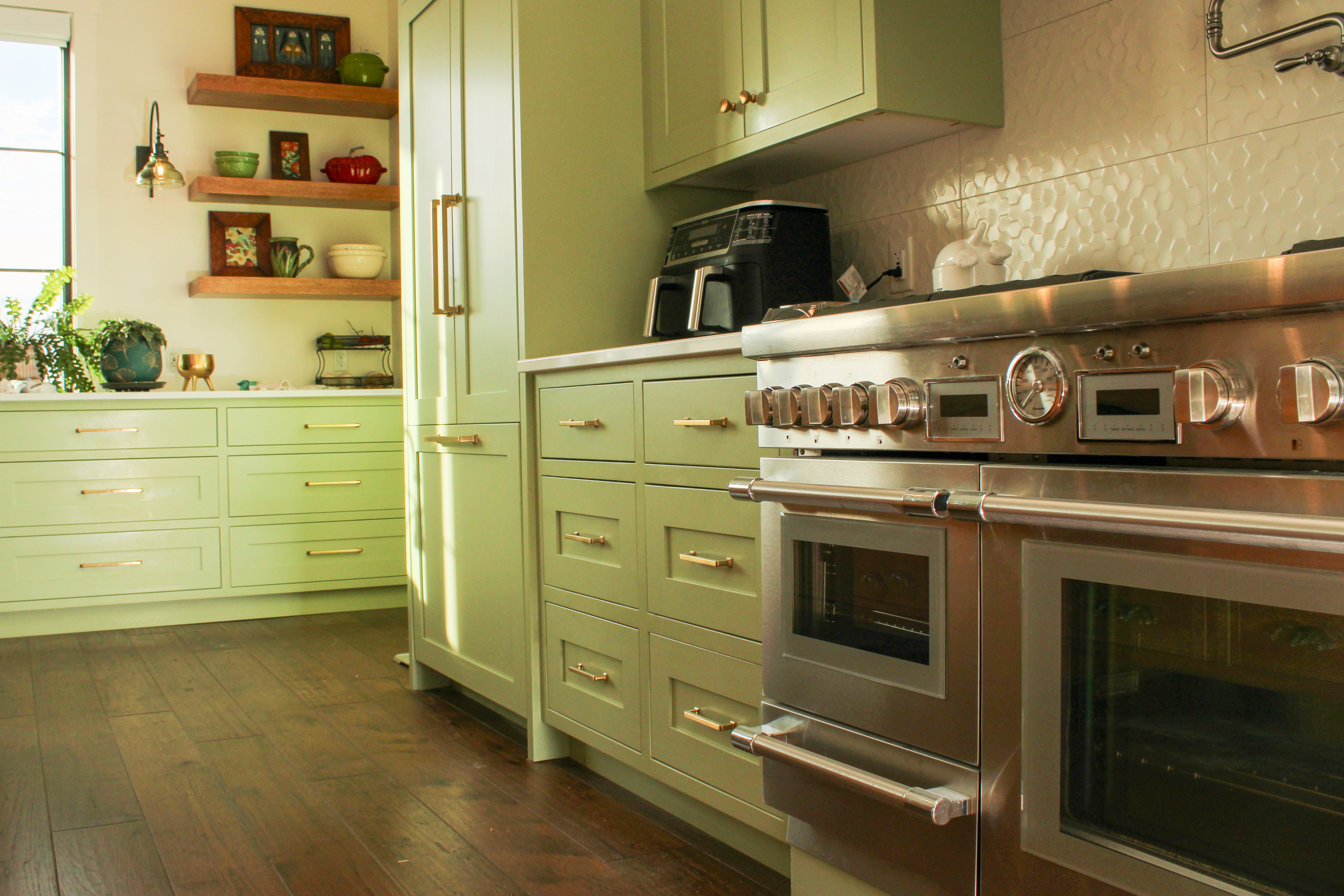 Close-up of green kitchen cabinets and oven in St. George Utah home remodel