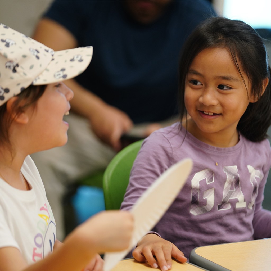 Elementary students engaging in a creative classroom activity during a HOKALI after-school enrichment program