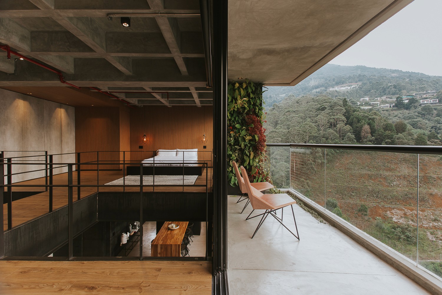 Double-height interior with flowing sculptural forms and warm raking light