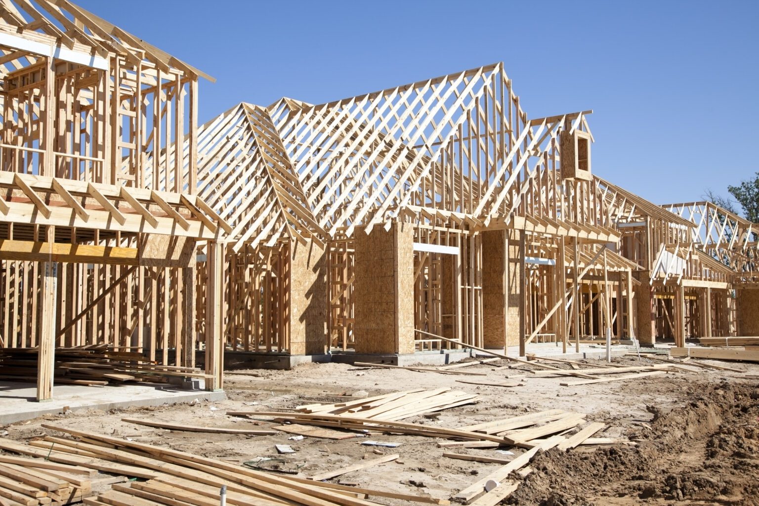 New homes under construction, wood framing visible