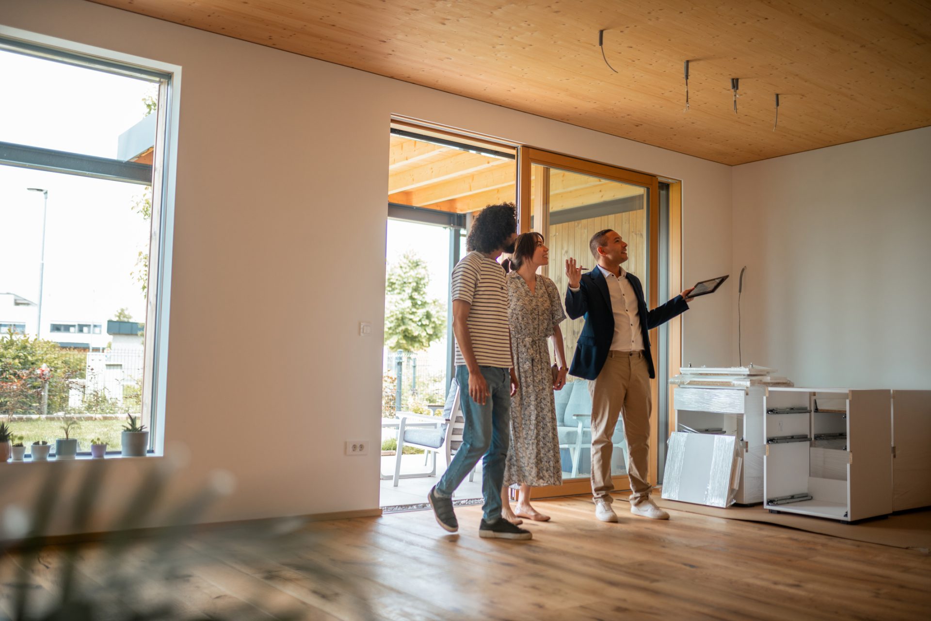 Realtor shows property to a couple.