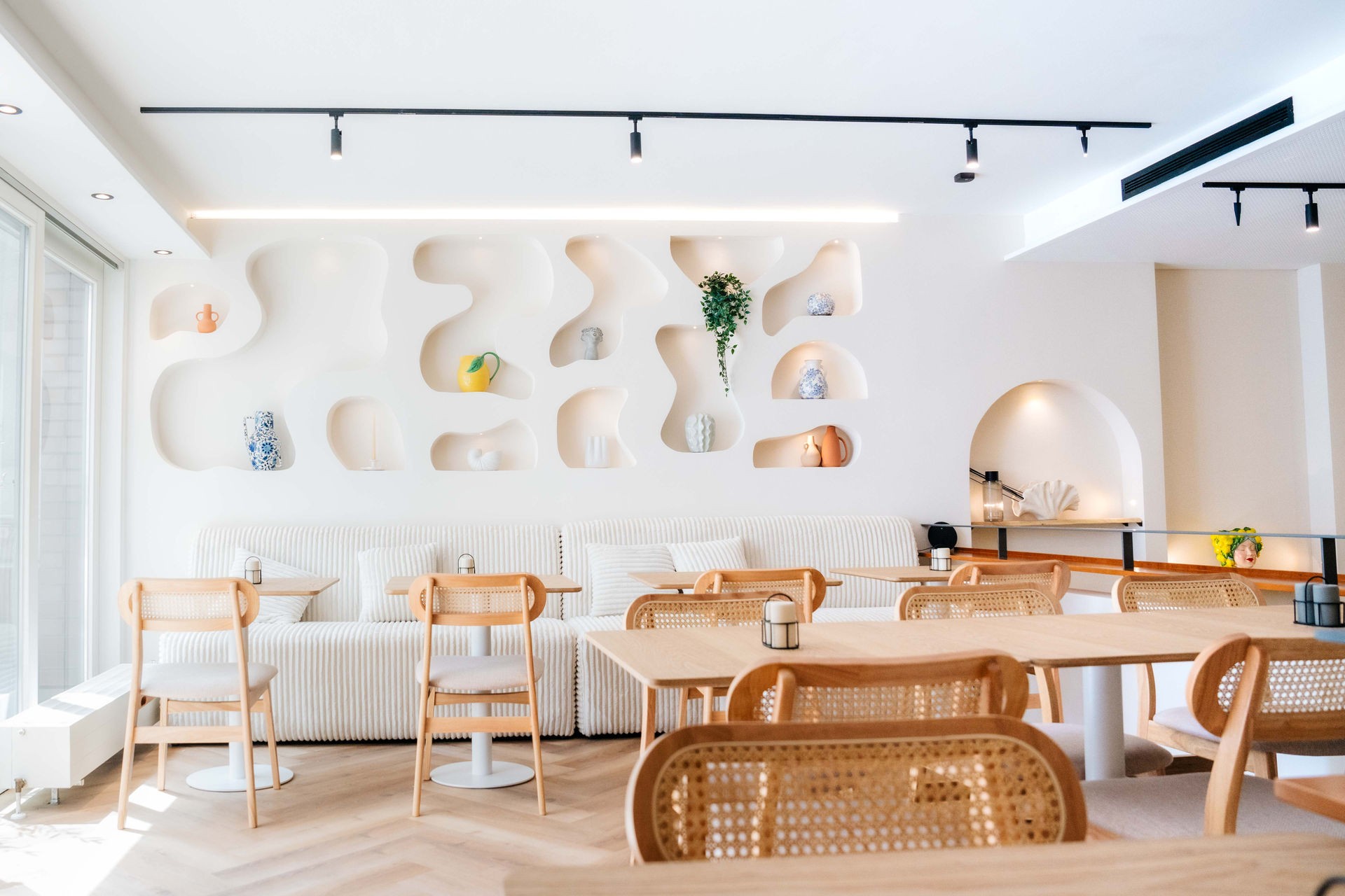 art deco styled bedroom with accsent mirror above the bed