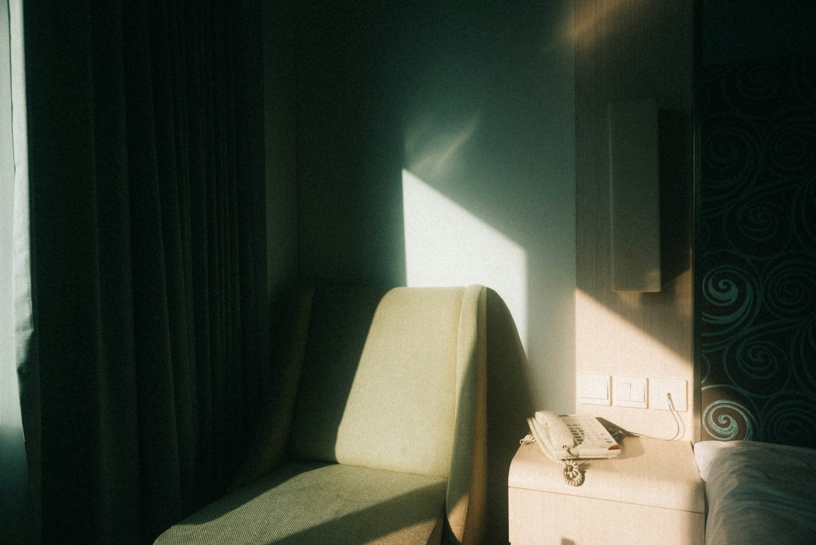 Sunlit suite detail with linen and architectural shadow