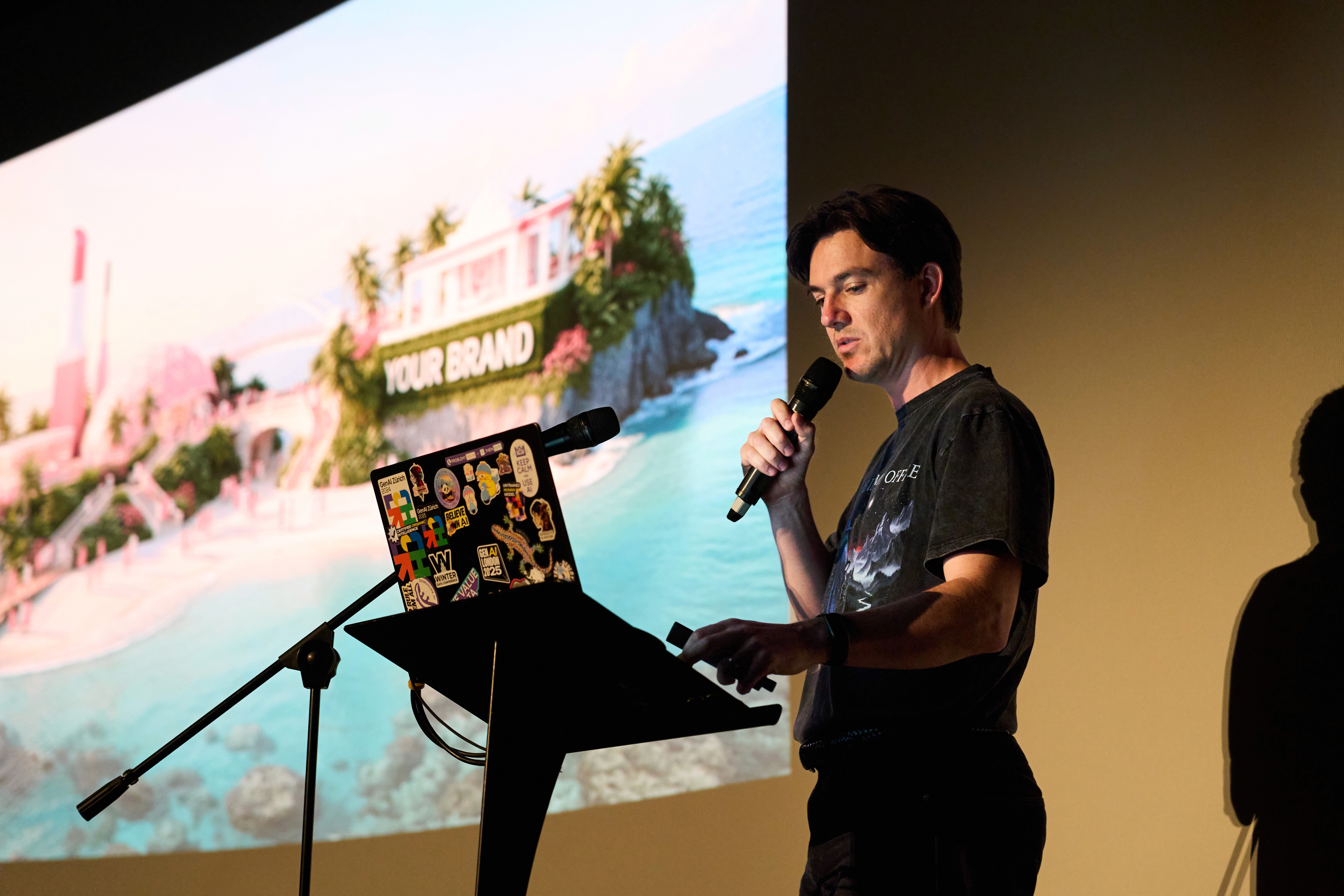 A speaker presenting AI-generated brand visuals on the cinema screen at the GenAI London 2026 Warm Up