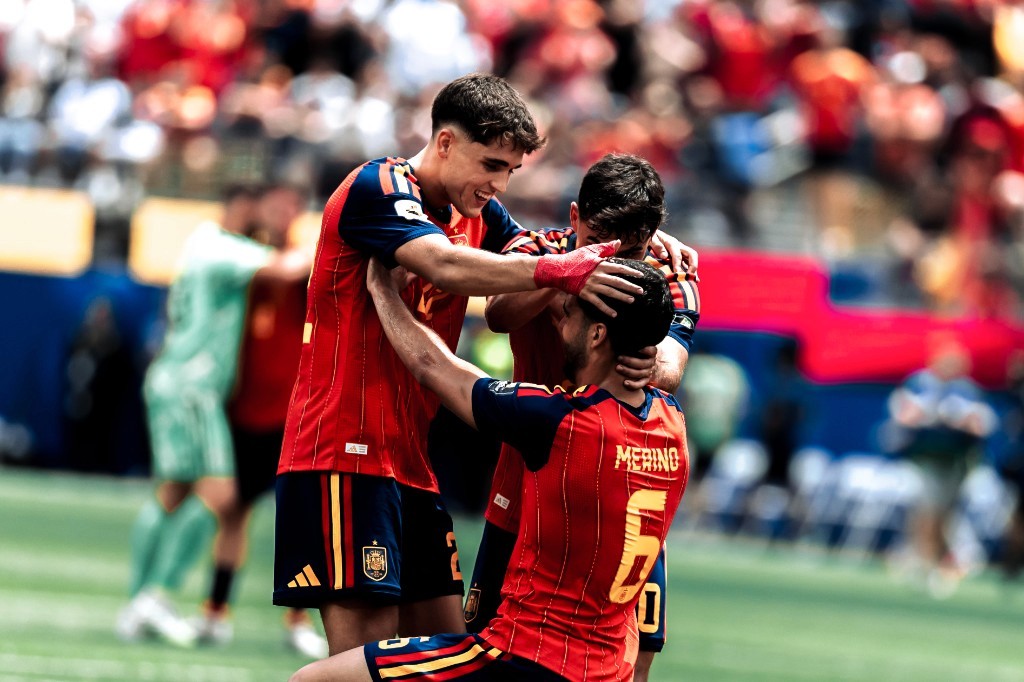 Spain's Mikel Merino celebrates with teammates after scoring against Belgium at the 2026 FIFA World Cup