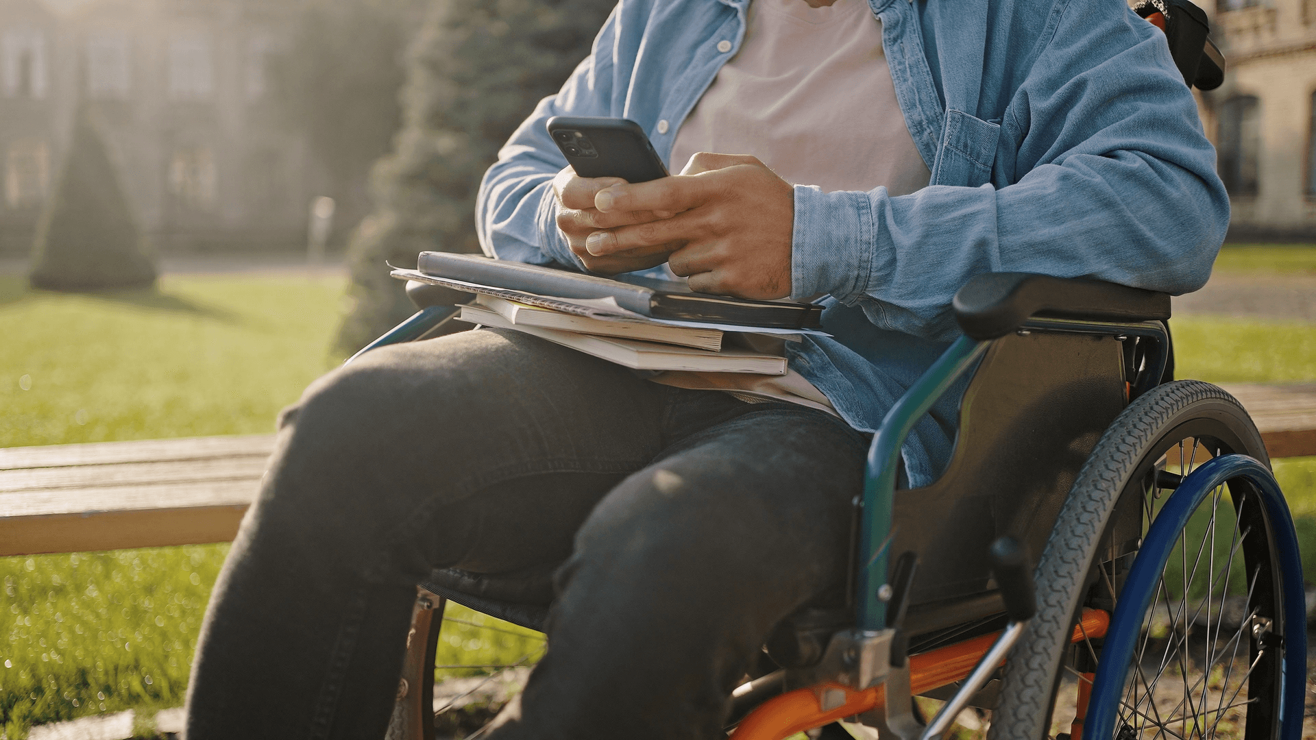 A person with a disability using their phone.