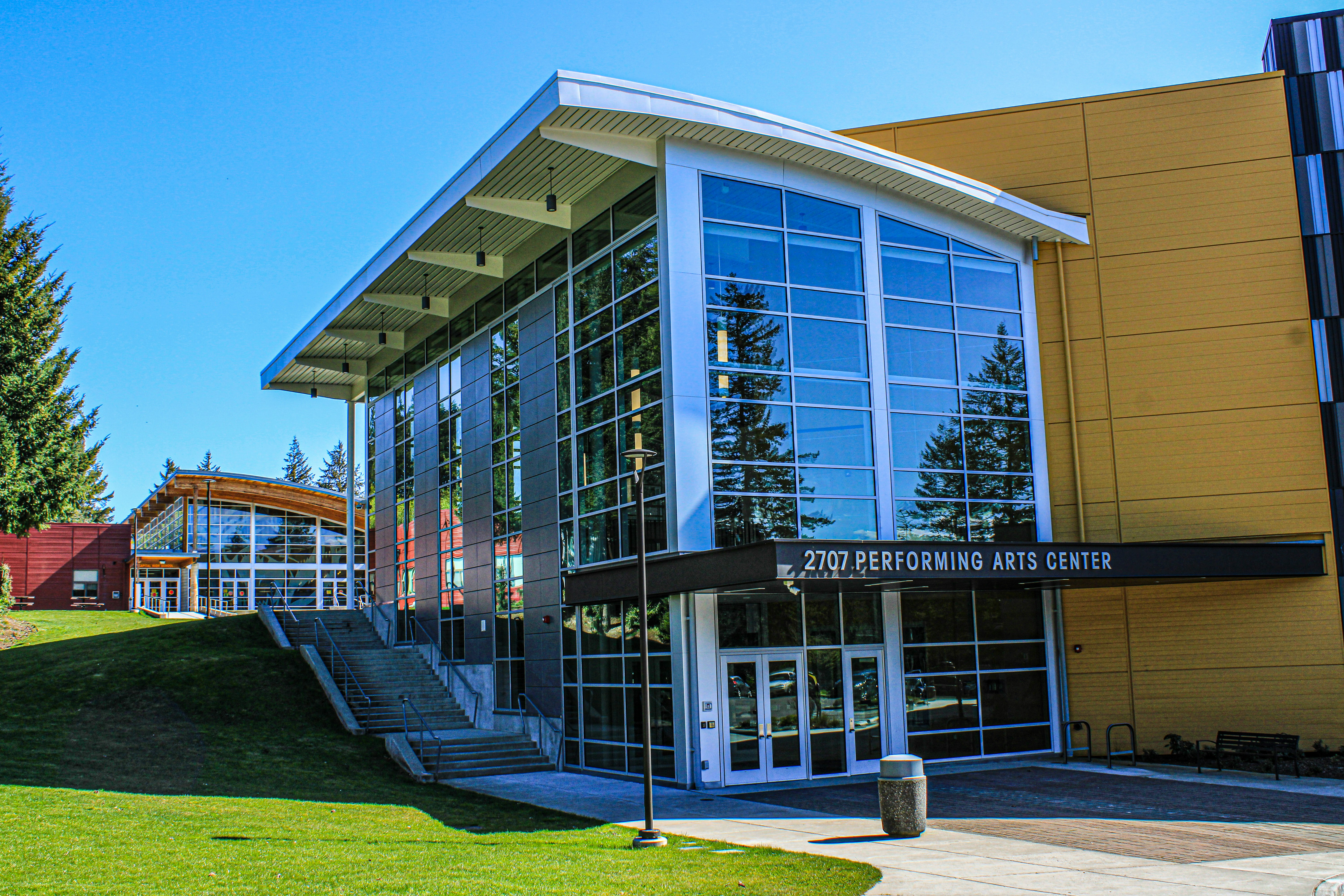 a building that has a lot of windows on it representing where Traingle2 hosts its conferences.