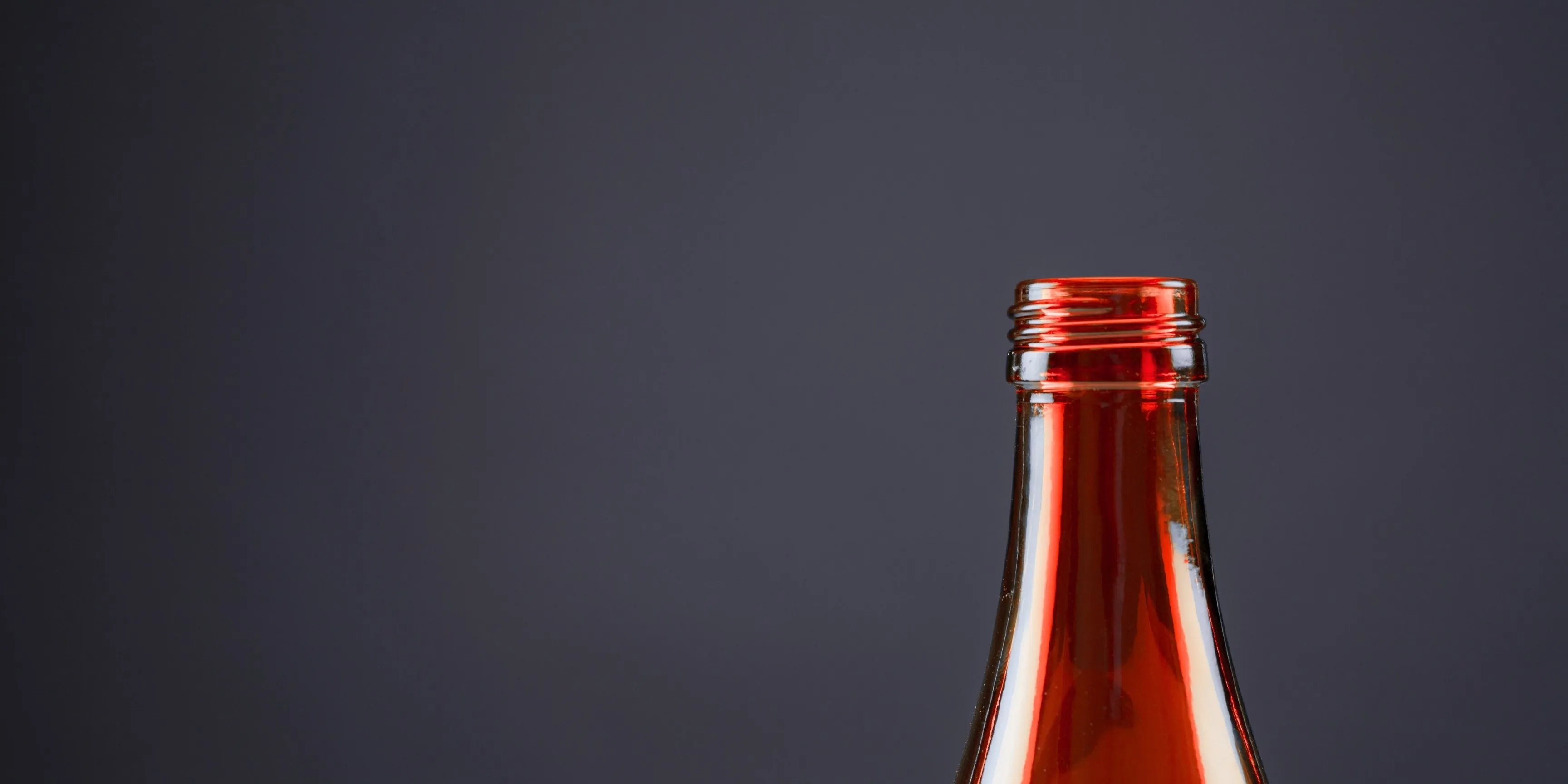 The neck of a glass bottle